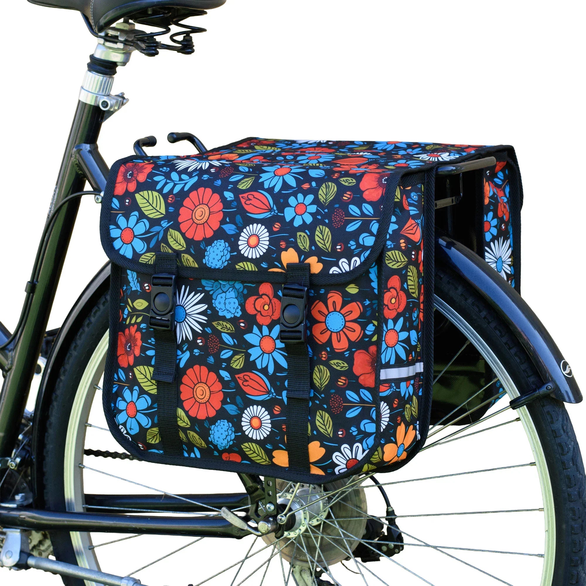 A floral double pannier bag attached to the rear rack of a bicycle.